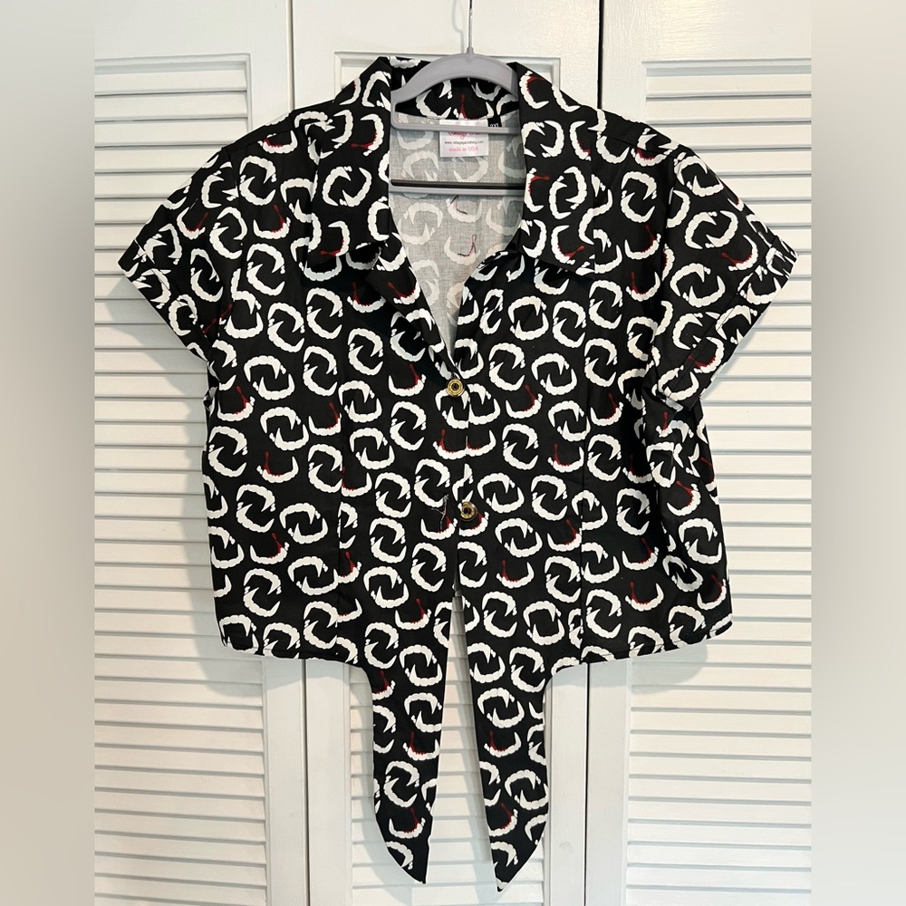 Button up top with vampire teeth
